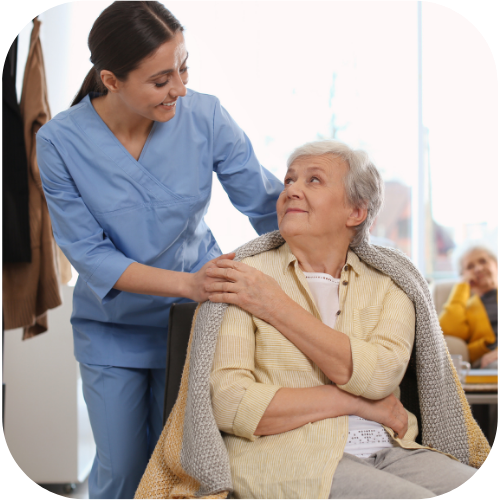 nurse taking care of elder woman